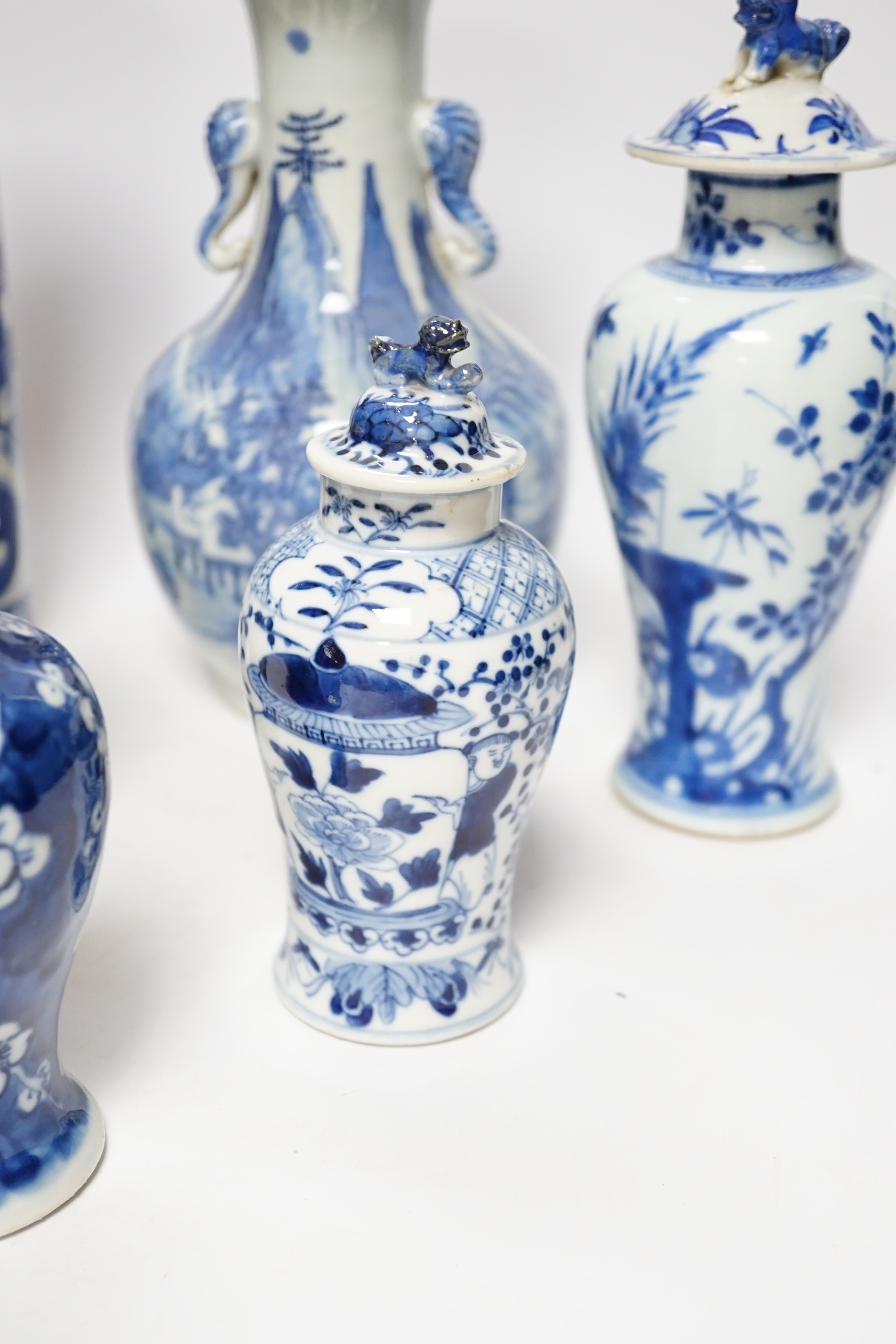 A late 19th century Chinese blue and white twin elephant head handle vase and five other 19th century Chinese blue and white vases, tallest 26cm
